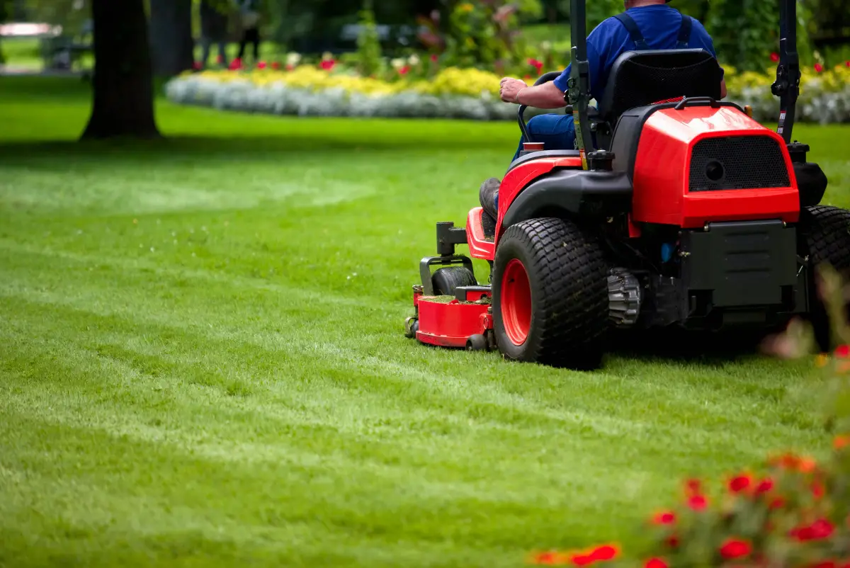 Zero-turn mower cutting clean stripes into a lawn